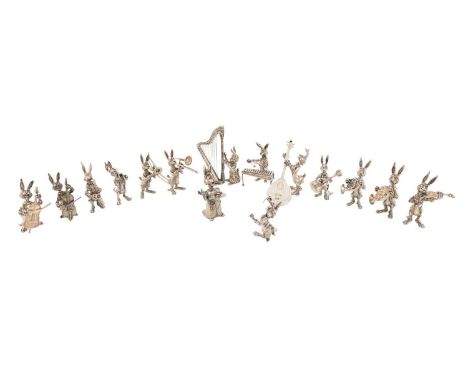 A modern Italian silver fifteen-piece rabbit/hare orchestra,standing and modelled playing various instruments, and with a fem