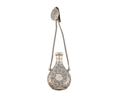 A Russian silver and niello work scent bottle, compressed baluster form, with scroll decoration and lettering, screw-off cove