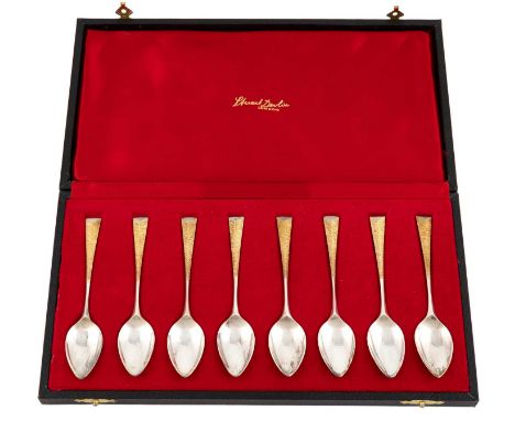 By Stuart Devlin, a set of eight modern parcel-gilt silver Arrow pattern coffee spoons, London 1979, the tapering silver-gilt