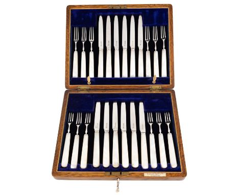 A set of twelve silver and mother-of-pearl fruit knives and forks,by Gibson &amp; Co Ltd, Sheffield 1913, retailed by Gibson 