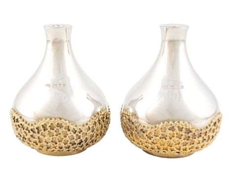 By Stuart Devlin, a pair of modern parcel-gilt silver salt and pepper pots, London 1981, onion form, with applied pieced text