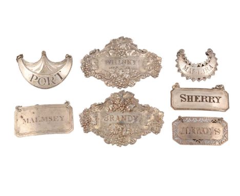 A small collection of silver wine labels,comprising: one by Hester Bateman, circa 1780, crescent form, with a pierced zigzag 