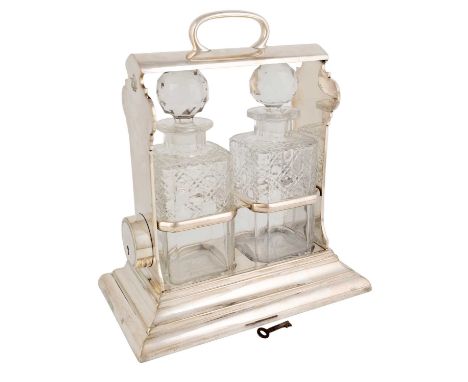 An electroplated 'holdfast' tantalus,by Walker &amp; Hall, Sheffield circa 1910,plain rectangular form, the key mechanism piv