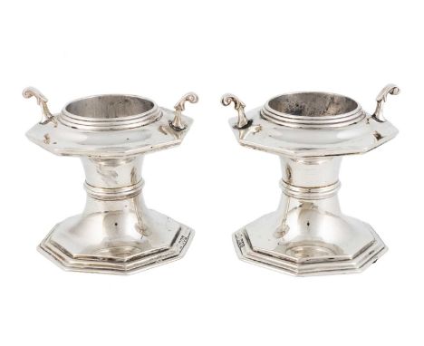 A pair of silver salts cellars,by Pairpoint Brothers, London 1913,raised octagonal form, the stem with a central reeded girdl