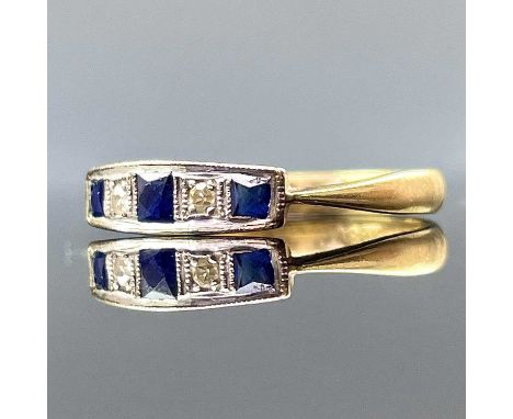 An 18ct gold and platinum diamond and sapphire five stone ring, the French cut centre sapphire measures 0.10ct approximately,