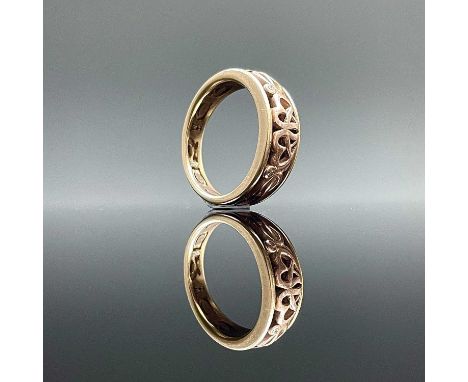 A modern 9ct Welsh Clogau Cariad bi-colour gold ring, set with two small diamonds, size M, weight 6 grams.