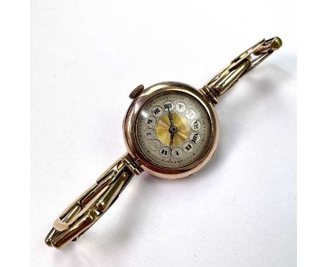 An early 20th century 9ct rose gold manual wind ladies wristwatch, with 15 jewel movement, on a 9ct expanding bracelet, weigh