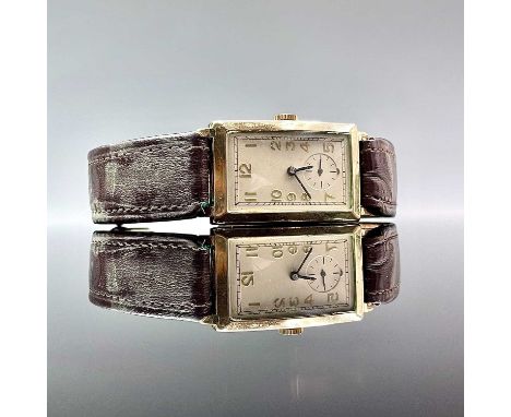 A pre-war Rolex 9ct gold gentlemans manual wind wristwatch, the 18mm width retangular cream painted dial with gilt Arabic num