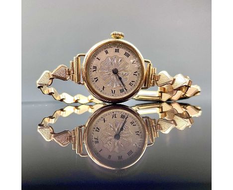 A 1930's 9ct ladies manual wind wristwatch, the 15 jewel movement by Centaur, on a gold plated bracelet, Birmingham 1930, wei