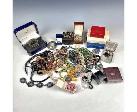 A quantity of costume jewellery.Condition report: The bangle in the blue box has a broken hinge. It is silver plated.