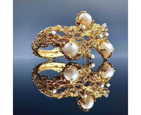 A 1960's high purity gold South Sea pearl and diamond set naturalist hinged bangle, in the style of Arthur King, modelled as 