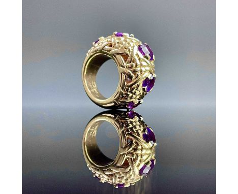 An extravagant Christian Dior 18ct gold amethyst set heavy five stonen ring, of knot design the largest stone measures 1.5ct,