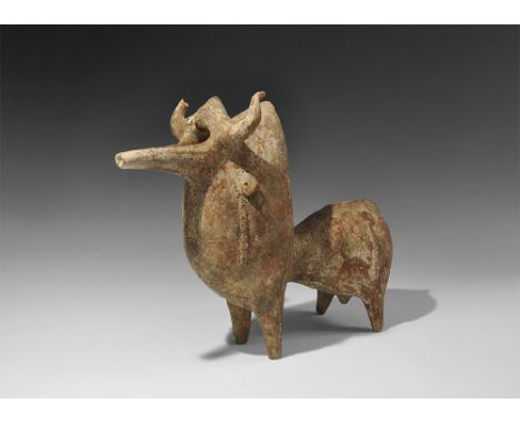  10th-8th century BC. A large ceramic vessel in the shape of a standing bull, the hollow vessel with cylindrical body and pro
