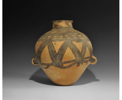  Neolithic, 3rd millennium BC. A ceramic vase with narrow base, biconical body, short tubular neck with everted rim, two loop