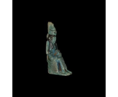  Late Period, 664-332 BC. A large blue-glazed composition amulet of seated goddess Mut wearing the pschent crown, nursing an 