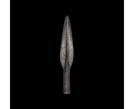  8th-10th century AD. A hand-forged iron spearhead comprising a leaf-shaped place with midrib, rounded point, octagonal-secti