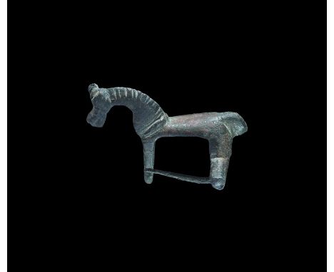  2nd century AD. A bronze zoomorphic brooch of a standing horse with halter and arched neck; beneath the rear legs a crossbar