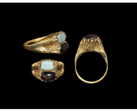  15th-16th century AD. A rectangular-section hoop and expanding shoulders supporting two box bezels with a band of foliage or