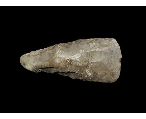  Neolithic, 5th-3rd millennium BC. A finely knapped flint axehead with narrow rounded butt, bifacial blade. 108 grams, 11cm (
