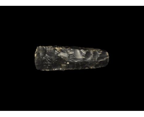  Neolithic, 5th-3rd millennium BC. A finely knapped axe with tapered squared sides and butt and slightly convex cutting edge;