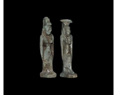  Late Period, 664-332 BC. A pale blue glazed composition amuletic pendant group comprising: a standing goddess Isis wearing s