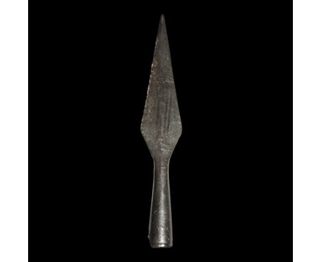  9th-12th century AD. A hand-forged iron spearhead with lozengiform and lentoid-section blade, tapering socket with transvers