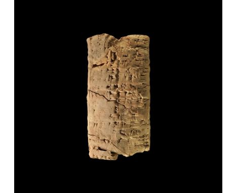  1924-1896 BC. A terracotta pillow-shaped tag with cuneiform text impressed over the rolled impressions of the scribe's cylin