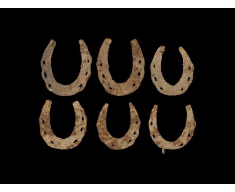  11th-12th century AD. A mixed group of iron horseshoes, each tapering towards the ends and with a raised burr finial, with s