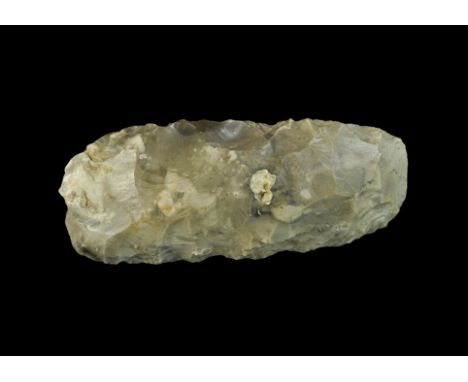  Mesolithic, circa 15000 BP. A large flint axe of lozenge section in a pale grey flint with a convex cutting edge and square 