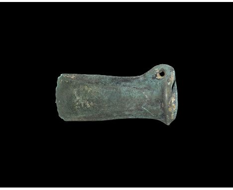 11th-9th century BC. A Wilburton type axehead with ribbed mouth, slightly flared edge with straight sides, narrow lateral lo