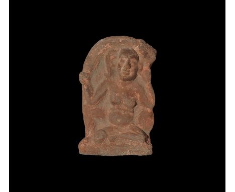  Roman Period, 30 BC-323 AD. A terracotta plaque depicting Harpocrates as a chubby child, sitting with genitals exposed, hand