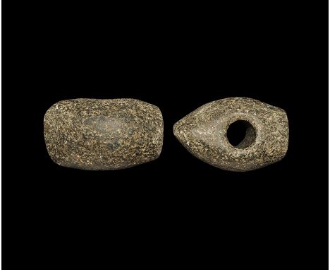  Neolithic, 4th-3rd millennium BC. A ground and polished basalt axe-hammer with tapering hole, one flat striking face and one