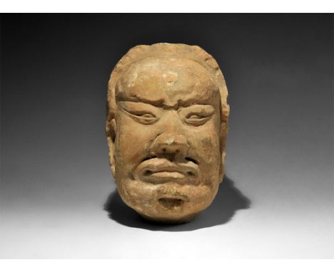  Song Dynasty, 960-1127 AD. A ceramic model head of Buddha with dressed hair and scrolled brim above the brow, shallow socket