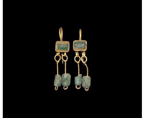 Later 2nd-3rd century AD. A matched pair of gold earrings, each a wire hook attached to a rectangular cell with beaded wire 