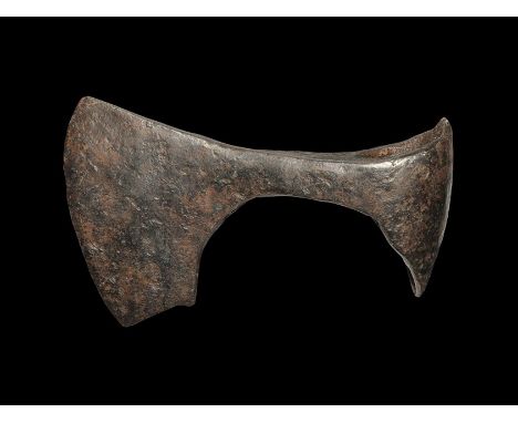  9th-12 century AD. A hand-forged iron axehead with curved edge, square chin to the blade, flared rear to the socket. Cf. Sed