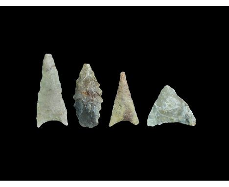  Neolithic, 5th-4th millennium BC. A mixed group of stone arrowheads comprising: two deltoid; one triangular; one leaf-shaped