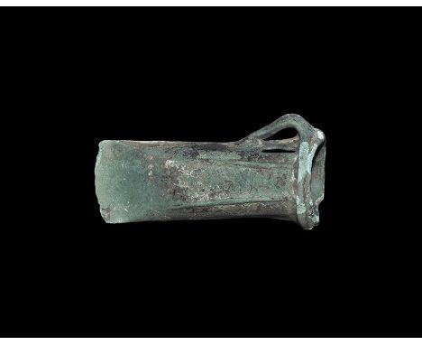  11th-9th century BC. A Wilburton type axehead with ribbed mouth, slightly curved edge with straight sides, narrow lateral lo