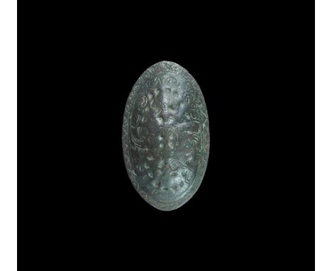  9th-10th century AD. A cast elliptical tortoise brooch with shallow central dome and narrow flange rim; to the dome, panels 