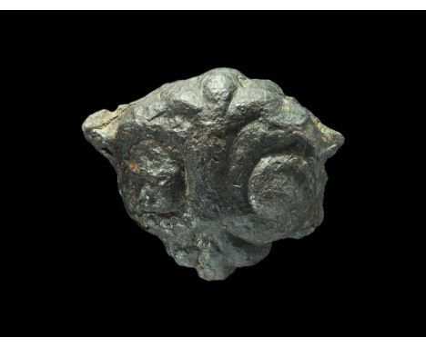  10th century AD. A heavy, iron sword pommel of Petersen's Type L with sub-triangular profile, a pair of opposed spiral eleme