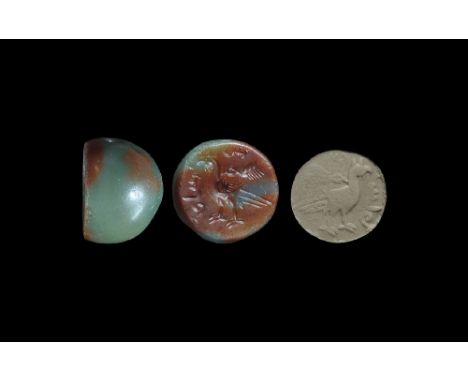  4th-6th century AD. A plano-convex green agate stamp seal with intaglio motif of a standing bird with a collar and text to t