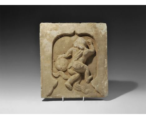  Song Dynasty, 960-1127 AD. A rectangular ceramic tile with central recess; dancing figure modelled in the half-round with on