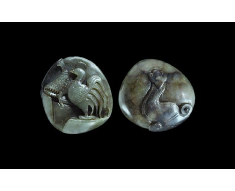  19th-20th century AD. A carved nephrite jade pebble with weather-darkened reverse face; a cockerel modelled in high relief w