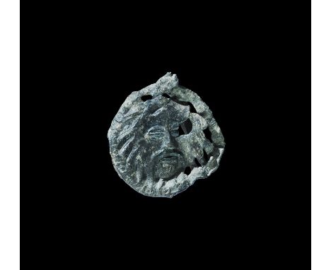 15th century AD. A pewter openwork badge depicting Christ's head in three-quarter view within a ring; pin and plate to the r
