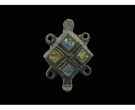  2nd century AD. A bronze lozengiform plate brooch with pierced lugs to the long edges, lobes top and bottom with ring-and-do