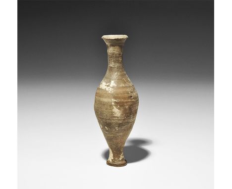  1st-3rd century AD. A slender ceramic flask with discoid foot, bulbous body, narrow neck and flared chamfered rim. 53 grams,