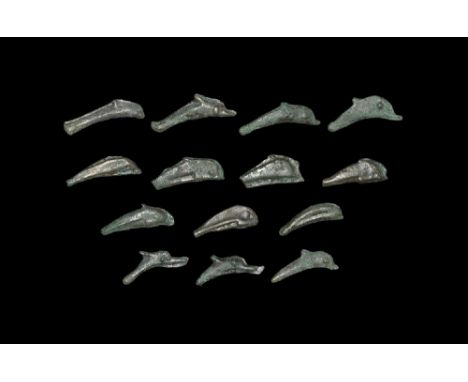  6th century BC. Group comprising: cast 'coins' or currency pieces in the form of a bifacial dolphin. Sear 1684. 29.56 grams 