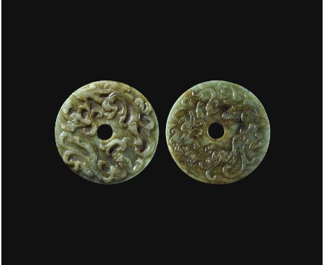  19th-20th century AD. A nephrite jade annular disc with low-relief frieze of chilong beasts and tendrils to one face, simila