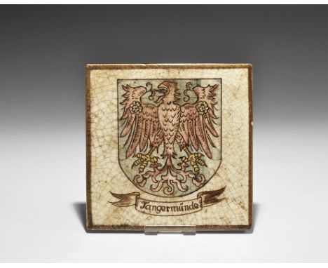  19th century AD. A square glazed ceramic wall tile with brown border, heater shield with splayed eagle on a blue field, rose