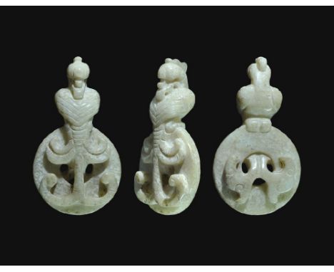  19th-20th century AD. A carved jadeite openwork fitting formed as a phoenix perched on a bi disc with bifid tail protruding 
