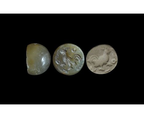  4th-6th century AD. An agate plano-convex stamp seal with intaglio cockerel motif, text to the border; supplied with a museu